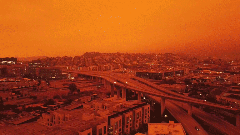 Ciudad con Cielo Rojo: GIF Animado Impactante sobre la Contaminación Ambiental