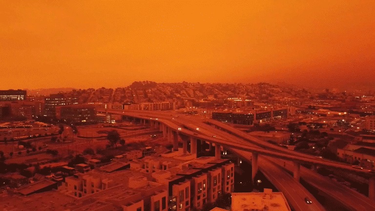 Ciudad con Cielo Rojo: GIF Animado Impactante sobre la Contaminación Ambiental